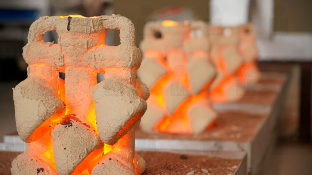 Investment casting robotic metal pouring line at Shilpan Steelcast